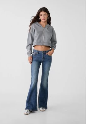 Stradivarius D04 rozszerzane jeansy z niskim stanem  Denim