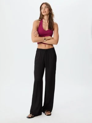 Stradivarius Długie, zwiewne spodnie satynowe  Czarny