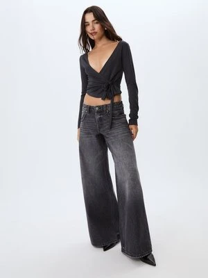 Stradivarius Jeansy niski stan szerokie nogawki gwiazdy  CZARNY DENIM Z EFEKTEM SPRANIA