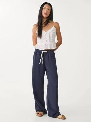 Zdjęcie produktu Stradivarius Luźne spodnie lyocell  Ciemnomorski