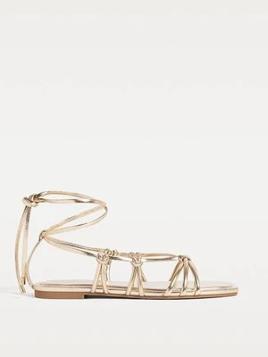 Stradivarius Płaskie sandały z paskami  ZŁOTY