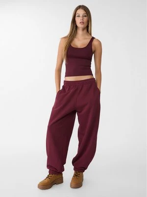 Zdjęcie produktu Stradivarius Pluszowe spodnie jogger oversize  Wiśniowy