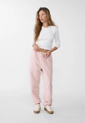 Stradivarius Spodnie jogger boyfriend z efektem sprania  Pudrowy róż