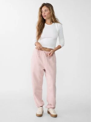 Stradivarius Spodnie jogger boyfriend z efektem sprania  Pudrowy róż