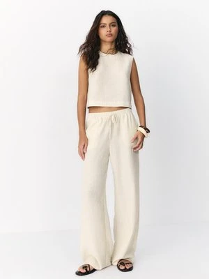 Stradivarius Spodnie w lnianym efekcie z metaliczną nicią  Kamień