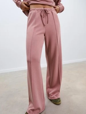 Stradivarius Spodnie z szerokimi nogawkami z przeszyciami i miękkie w dotyku Różowy