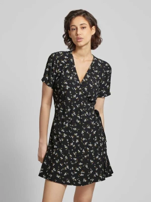 Sukienka kopertowa ze wzorem na całej powierzchni Tommy Jeans