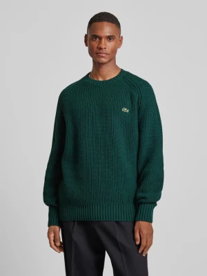 Sweter z dzianiny z wełny z naszywką z logo model ‘BEADED’ Lacoste