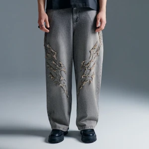 Szare jeansy baggy fit skater z aplikacjami tribal House