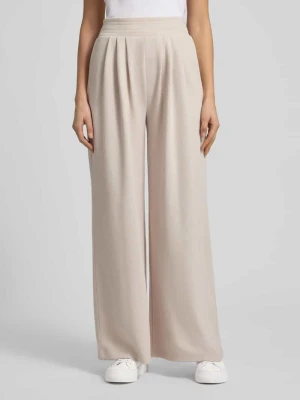 Szerokie spodnie materiałowe z zakładkami Christian Berg Woman