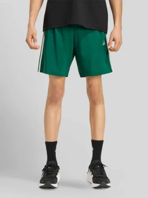 Szorty sportowe o kroju regular fit z bocznymi wpuszczanymi kieszeniami Adidas Zielony