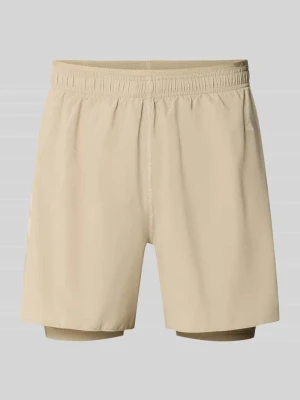 Szorty sportowe o kroju regular fit z nadrukiem z logo model 'ADI365 / 2i1 M' Adidas Beżowy
