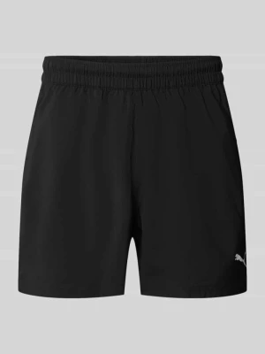 Szorty sportowe o kroju regular fit z nadrukiem z logo model „TAD ESSENTIALS” Puma Czarny