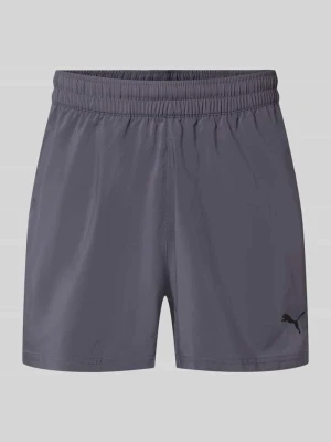 Szorty sportowe o kroju regular fit z nadrukiem z logo model „TAD ESSENTIALS” Puma Grafitowy