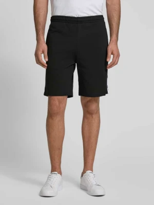 Szorty z dzianiny dresowej o kroju regular fit z lampasami Lacoste