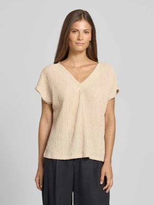 T-shirt o kroju relaxed fit z dekoltem w serek i ozdobnymi plisami Christian Berg Woman