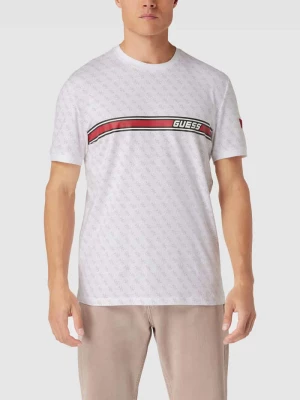 T-shirt z logo na całej powierzchni model ‘JAMEY’ Guess Activewear