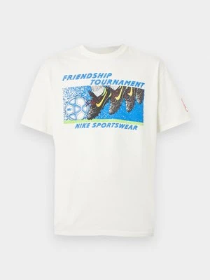 T-shirt z nadrukiem Nike mleczny