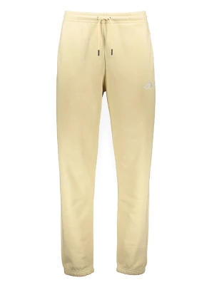 The North Face Spodnie dresowe "Essentials" w kolorze kremowym rozmiar: L