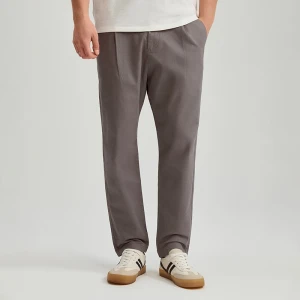 Tkaninowe grafitowe spodnie carrot fit z zakładkami House