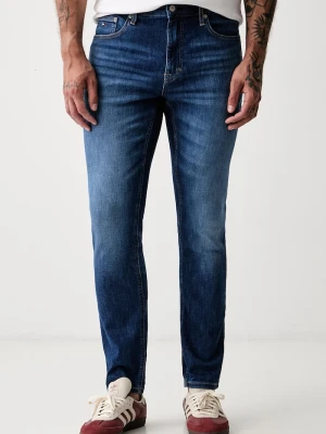 Tommy Jeans jeansy slim taper męskie niebieski