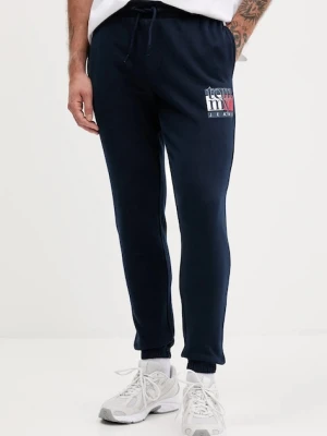 Tommy Jeans spodnie dresowe bawełniane męskie kolor granatowy z nadrukiem DM0DM22094