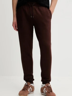 Tommy Jeans spodnie dresowe kolor brązowy gładkie DM0DM20473
