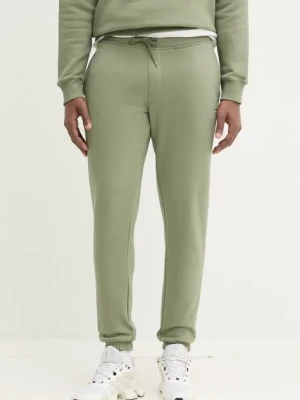 Tommy Jeans spodnie dresowe kolor zielony gładkie DM0DM20473