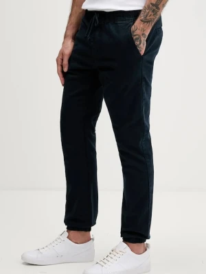 Tommy Jeans spodnie męskie kolor granatowy DM0DM23102