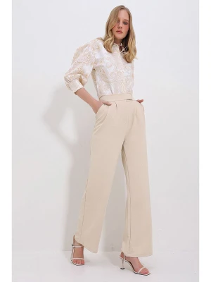 trendyol Spodnie w kolorze beżowym rozmiar: XL