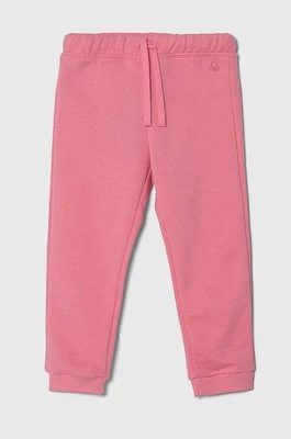 United Colors of Benetton spodnie dresowe bawełniane dziecięce kolor różowy gładkie