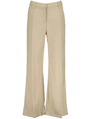 Vingino Spodnie "Serina" w kolorze beżowym rozmiar: 176