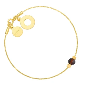 Złota bransoletka z Karmą i brązowym kryształem SWAROVSKI® CRYSTAL SOTHO